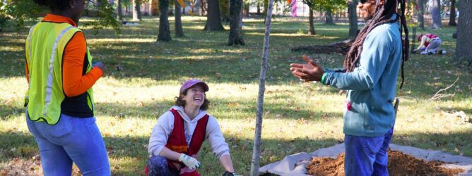 Volunteers planting a tree