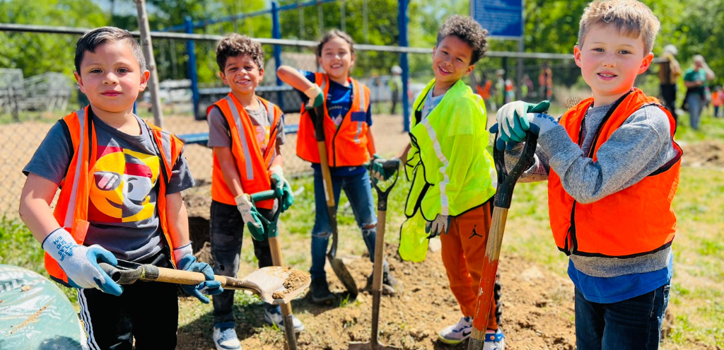 Students with shovels planting