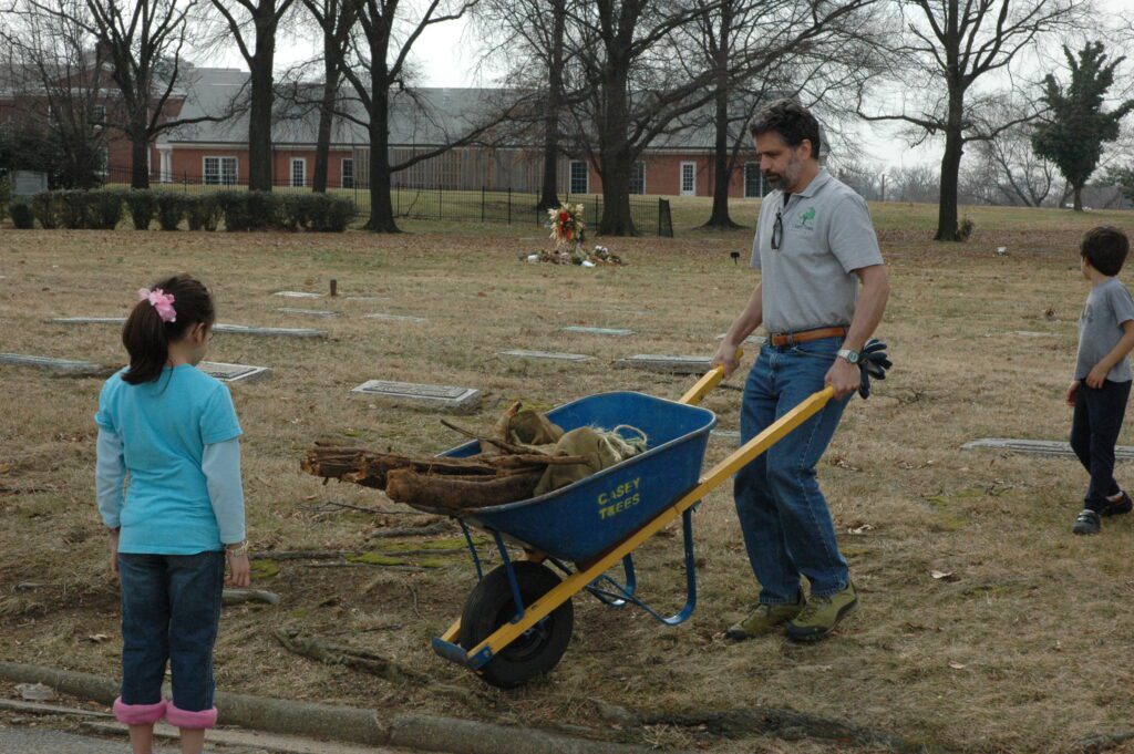 Mark Buscaino pushing a wheelbarrow
