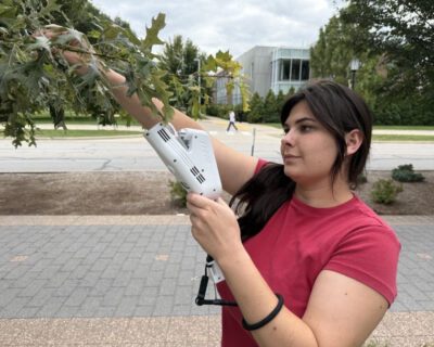 GCA Scholar Mary-Margaret takes spectral images of a tree's leaves for her research.