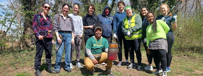 A group of volunteers smile for a photo.