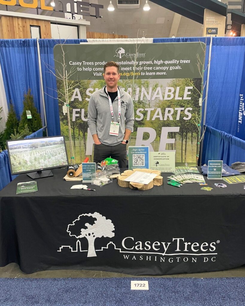 Farm Director Kyle mans the Casey Trees booth at MANTS.