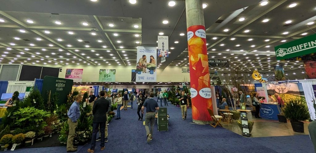 The exhibition hall at MANTS, showing multiple booths and attendees.