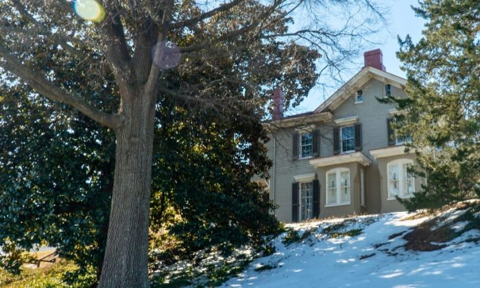Frederick Douglass' home at Cedar Hill; a house on a hill surrounded by large trees.