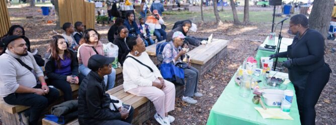 People sit in the park at THEARC.