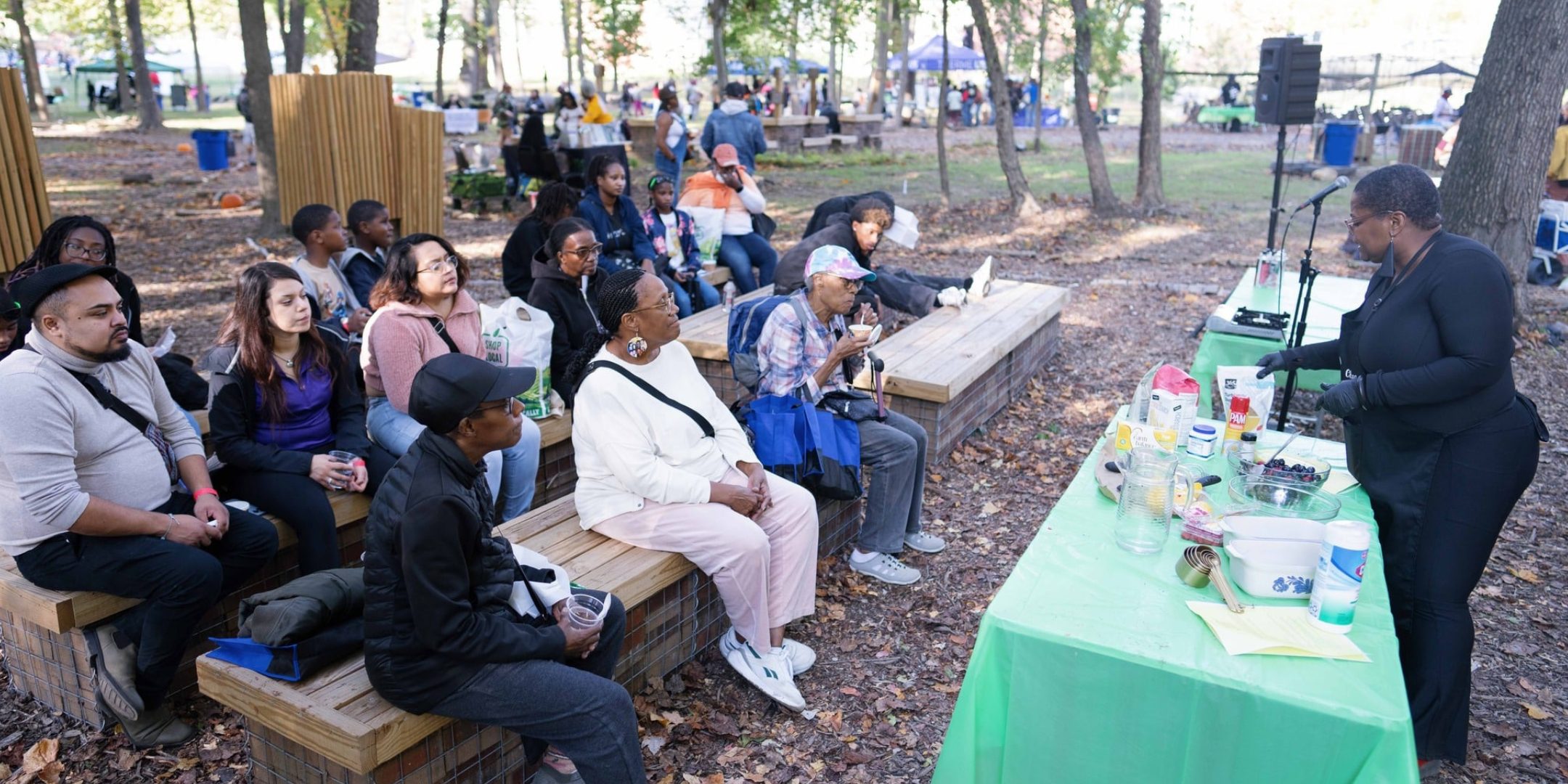 People sit in the park at THEARC.