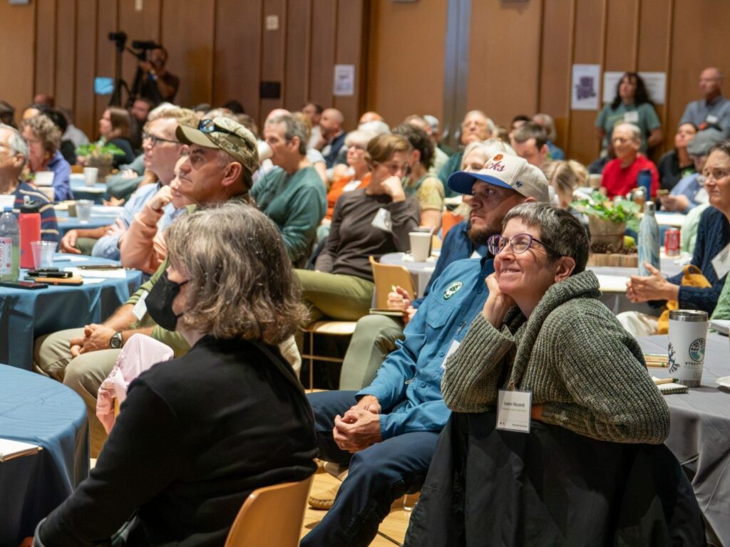 Attendees listen to speaker Tom Hill at the Urban Tree Summit.